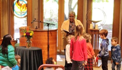 Rev Connie and Kids in Worship
